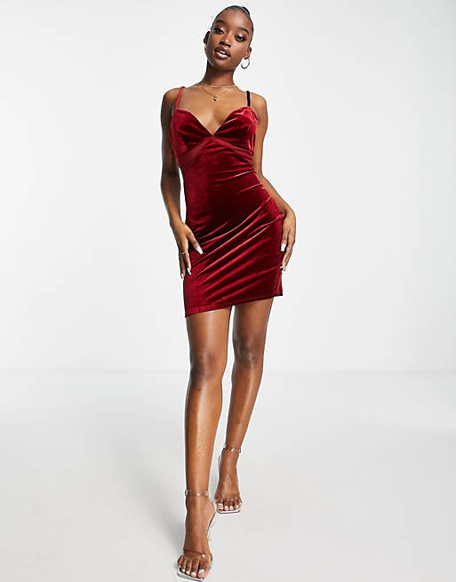 Women velvet mini dress with mesh cut outs in berry 