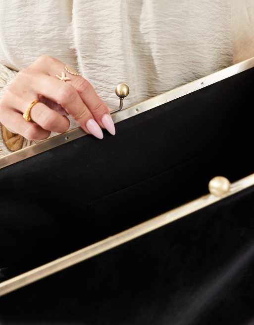 ASOS DESIGN velvet touch oversized frame clutch bag in black