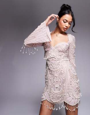 ASOS DESIGN - Verziertes Minikleid in Hellrosa mit ausgestellten Ärmeln und Bogenkante