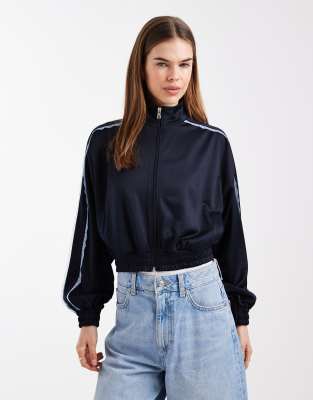 ASOS DESIGN - Veste de survêtement en maille à col cheminée et détail en dentelle - Bleu marine