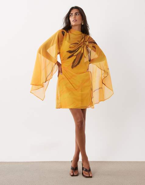 ASOS DESIGN - Vestido corto amarillo con estampado floral, cuello alto, mangas estilo capa y parte delantera drapeada - view 1