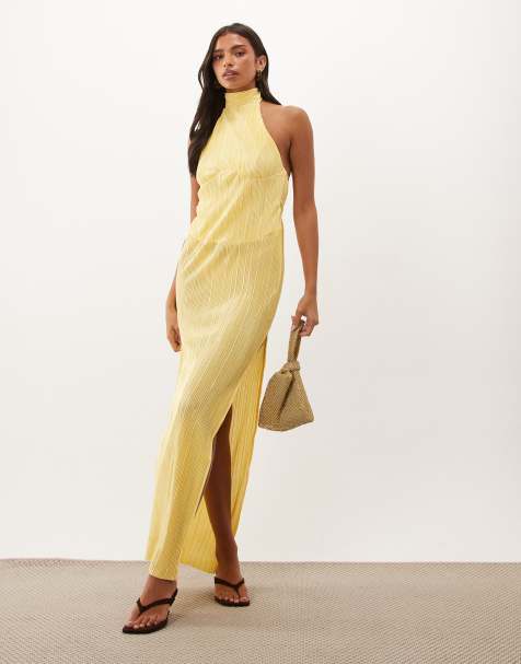 ASOS DESIGN - vestido maxi plisado con cuello halter y adornos de corsage en amarillo - view 1