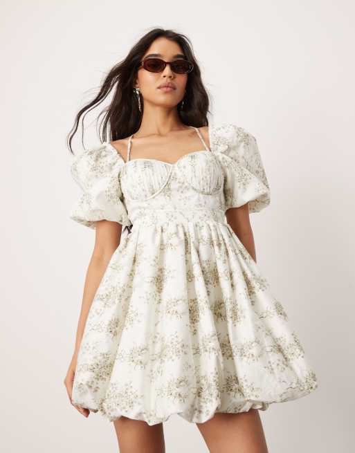 ASOS DESIGN - Vestito corto con maniche a sbuffo e corsetto con pinces con stampa a fiori e fiocco