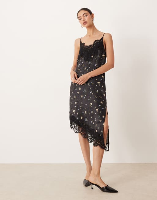 ASOS DESIGN - Vestito corto in raso nero a fiori asimmetrico con corpino in pizzo e spalline sottili