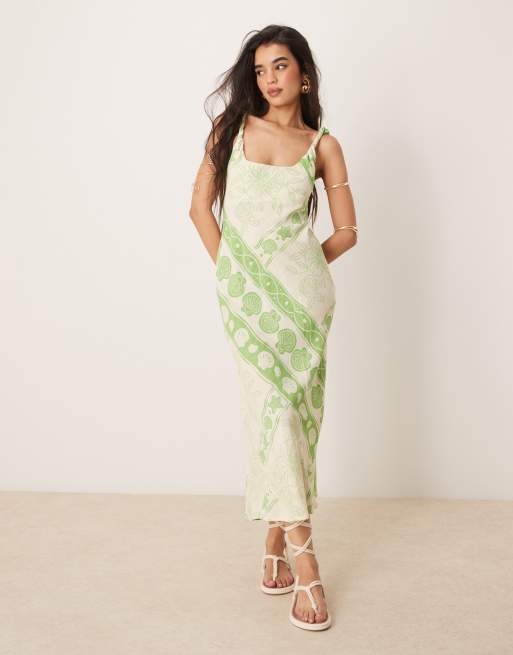 ASOS DESIGN - Vestito lungo effetto lino con spalline attorcigliate, stampa fantasia e taglio sbieco
