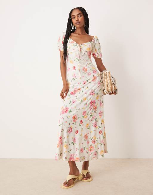 ASOS DESIGN - Vestito midi da giorno con stampa a fiori, maniche a sbuffo, cuciture a vista e colletto ondulato