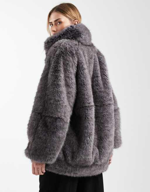 ASOS DESIGN vintage 80s faux fur jacket with gold brooch detailing