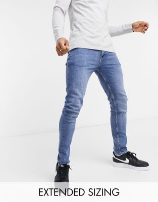 ASOS DESIGN vintage look skinny jeans in mid wash blue-Blues