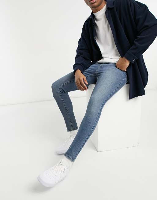 ASOS DESIGN - Vintage-look spray-on jeans met powerstretch in middenblauw