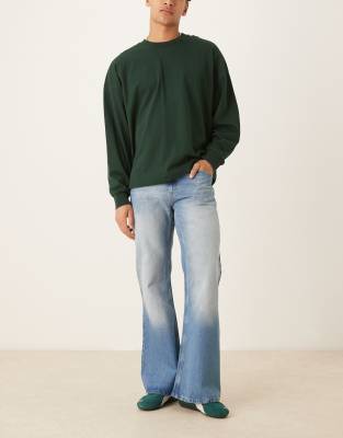 ASOS DESIGN – Vintagetvättade jeans med utsvängd design och vida ben - view 1