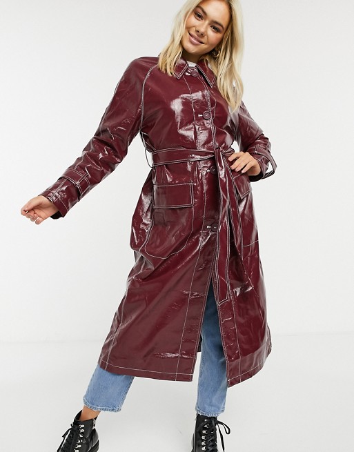 ASOS DESIGN vinyl trench coat with contrast stitching in oxblood | ASOS