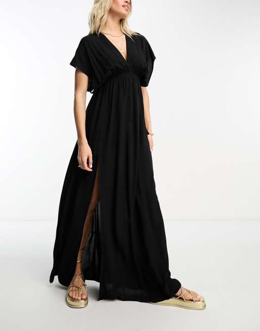 ASOS DESIGN - Vollere buste - Maxi-strandjurk met fladdermouwen en aangerimpelde, gestrikte taille in zwart , 2 van 4