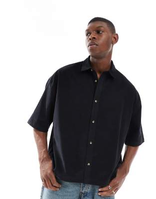 ASOS DESIGN volume oversized washed baby cord shirt in black - view 1