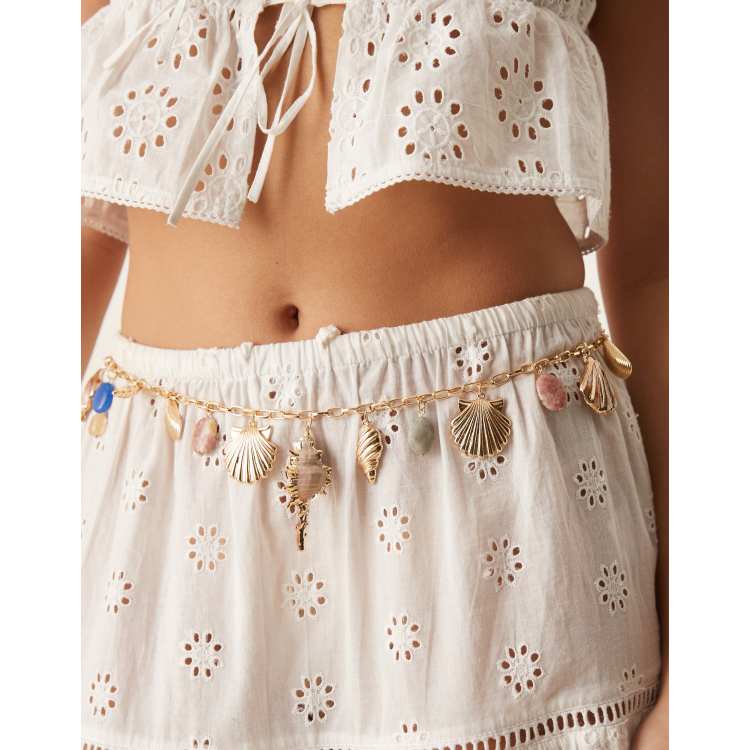 ASOS DESIGN waist and hip chain belt with faux shells charms and stones in  gold | ASOS