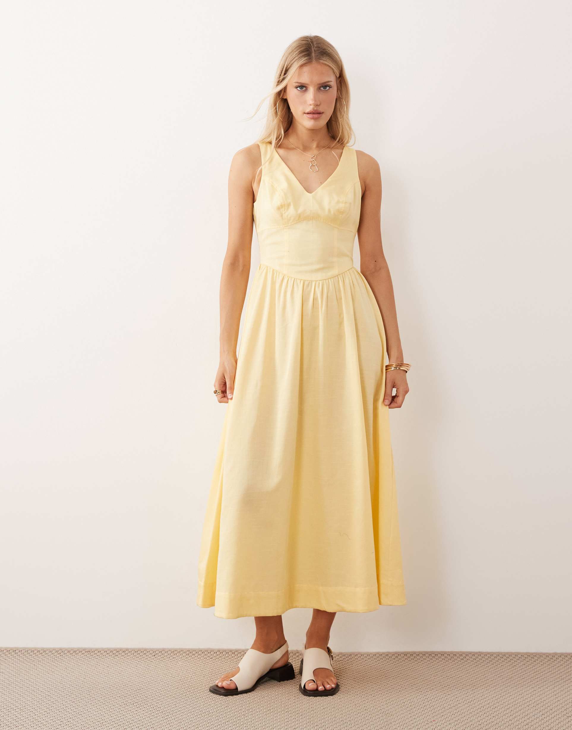 asos design waisted v neck maxi dress with seaming details in butter yellow