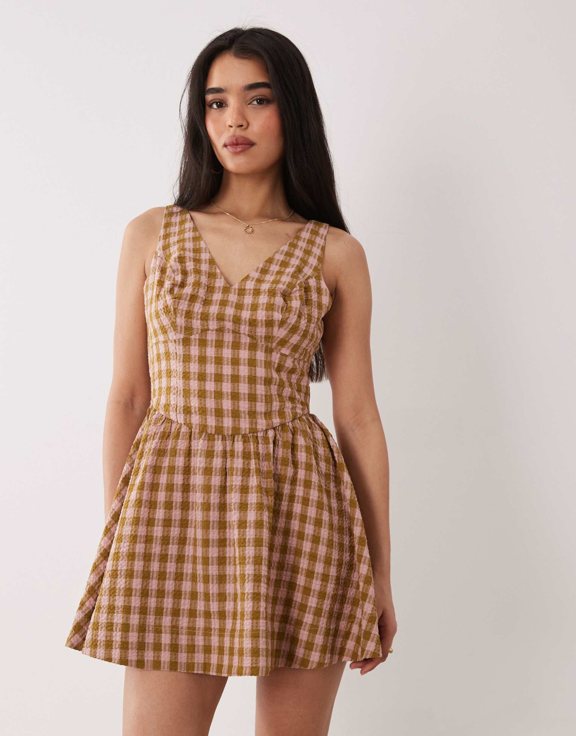 asos design waisted v-neck mini sundress with seaming details in brown and pink check