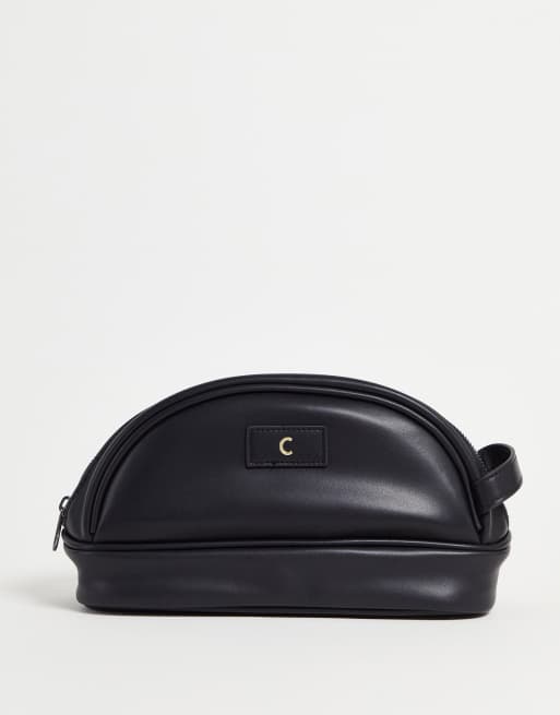 ASOS DESIGN washbag in faux leather with C initial in black