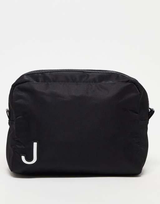 ASOS DESIGN washbag in with J initial in black