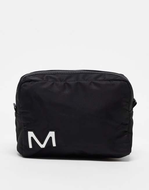 ASOS DESIGN washbag in with M initial in black 