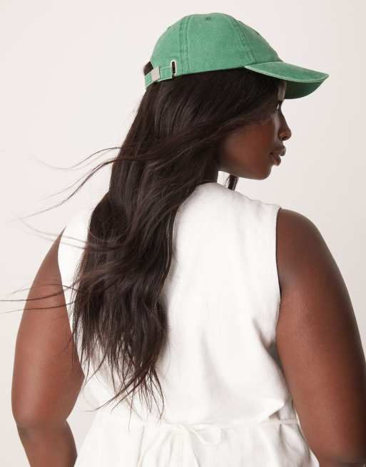 ASOS DESIGN washed cap in green with slogan