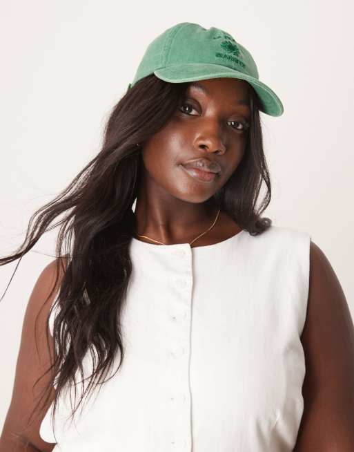ASOS DESIGN washed cap in green with slogan