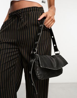 ASOS DESIGN washed shoulder bag with eyelet strap in black