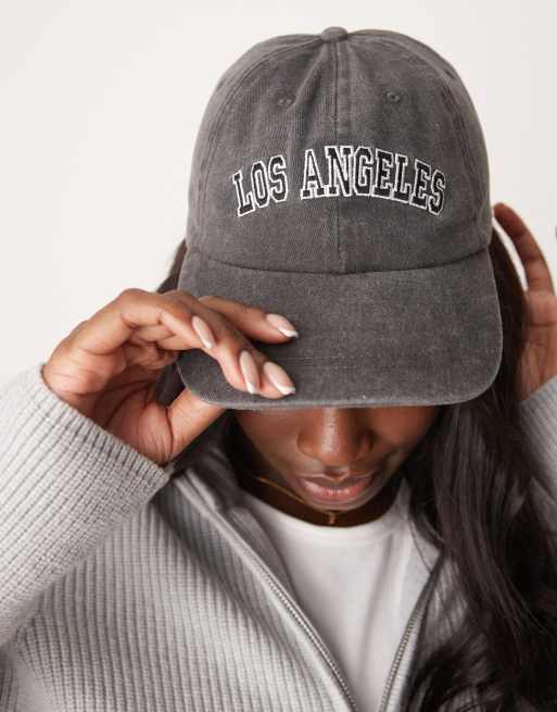 ASOS DESIGN washed slogan cap in black