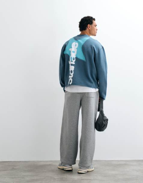 ASOS DESIGN washed sweatshirt with print and raw edges and inside out seams in blue - view 1