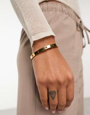 ASOS DESIGN waterproof stainless steel bangle with celestial design in gold tone