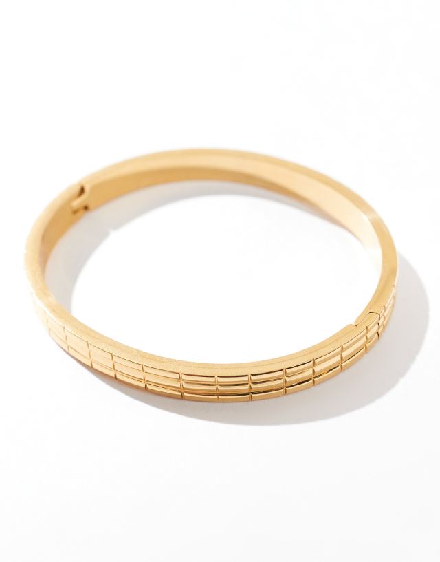 ASOS DESIGN - waterproof stainless steel bangle with engraved detail in gold tone