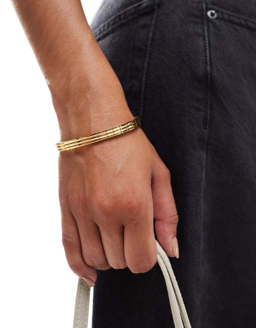 ASOS DESIGN waterproof stainless steel bangle with engraved detail in gold tone ASOS