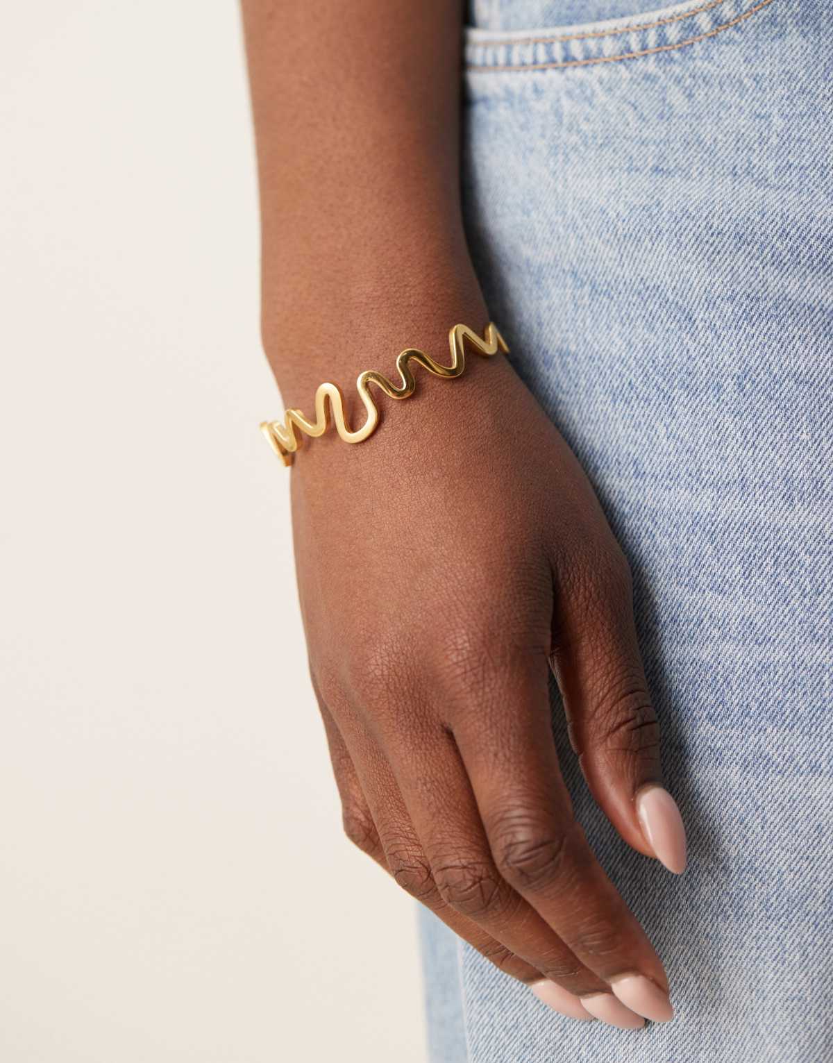ASOS DESIGN waterproof stainless steel bracelet with wiggle detail in gold tone