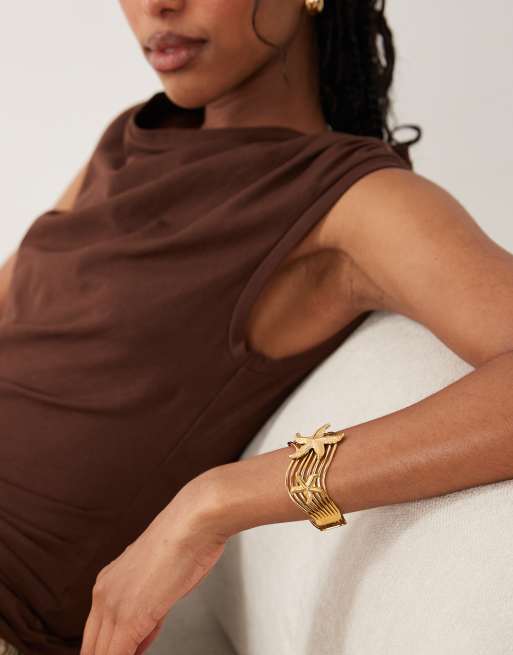 ASOS DESIGN waterproof stainless steel cuff with starfish design in gold tone, 3 of 4