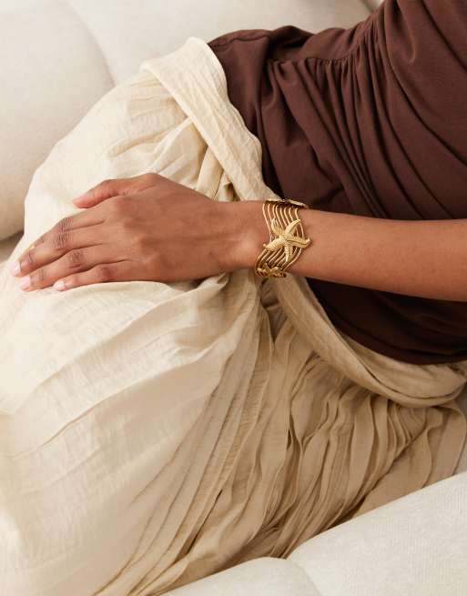 ASOS DESIGN waterproof stainless steel cuff with starfish design in gold tone, 4 of 4