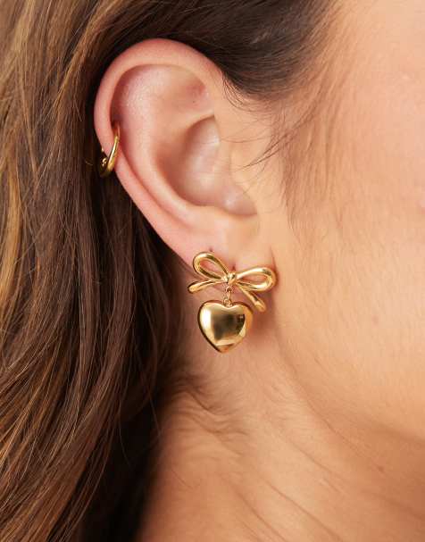ASOS DESIGN waterproof stainless steel earrings in heart and bow design in gold tone - view 1