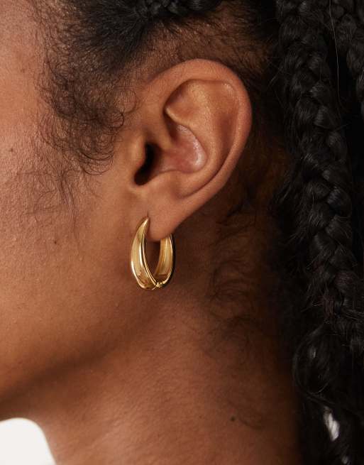 ASOS DESIGN waterproof stainless steel hoop earrings with oval design in gold tone, 2 of 4