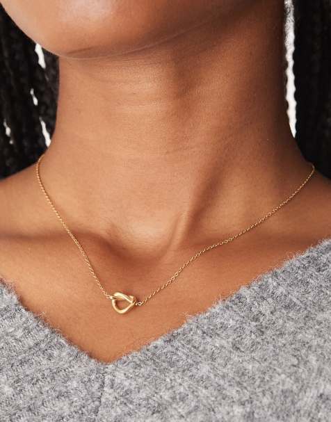 ASOS DESIGN waterproof stainless steel necklace with knot pendant in gold tone - view 1