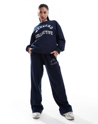 ASOS DESIGN Weekend Collective oversized sweatpants with varsity logo in navy