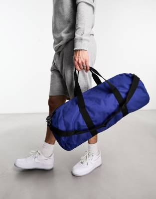 ASOS DESIGN weekend holdall barrel bag in blue nylon with contrast puller Smart Closet
