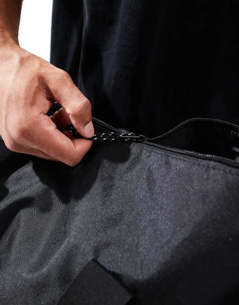 ASOS DESIGN weekend holdall barrel bag with contrast puller in black - view 2