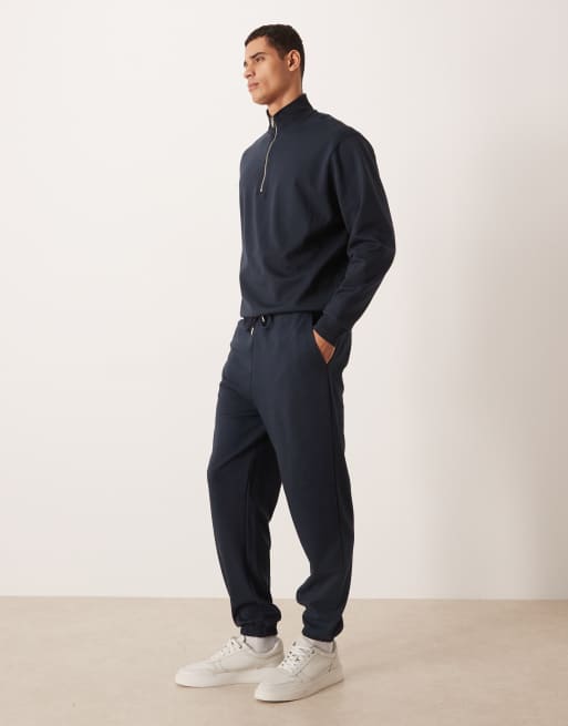 ASOS DESIGN – Weiche, schmal zulaufende Jogginghose in Marineblau, Kombiteil, 3 von 5