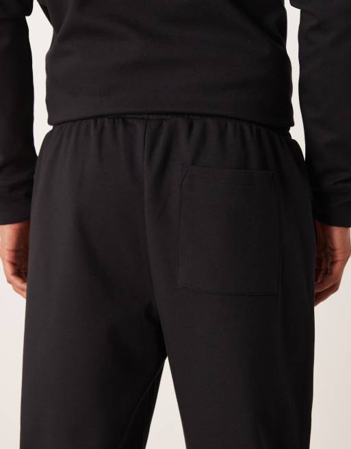 ASOS DESIGN – Weiche, schmal zulaufende Jogginghose in Schwarz, Kombiteil, 4 von 5