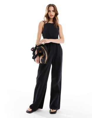 ASOS DESIGN - Weicher Denim-Jumpsuit in Schwarz mit Bindeband hinten