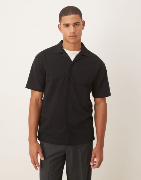 ASOS DESIGN – Weiches, locker geschnittenes Polohemd aus schwerem Stoff in Schwarz - view 1
