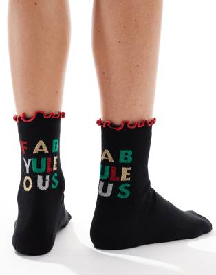 ASOS DESIGN - Weihnachten - Socken in Schwarz mit Weihnachtsspruch und Rüschenrand