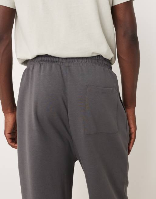 ASOS DESIGN – Weit geschnittene Jogginghose in Dunkelgrau mit Bundfalten, 4 von 5