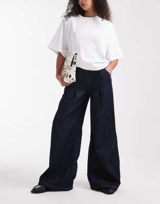 ASOS DESIGN - Weite Jeans in Indigoblau mit Bundfalten-Marineblau
