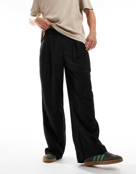 ASOS DESIGN – Weite Oversize-Chinohose in Schwarz mit Bundfalten - view 1
