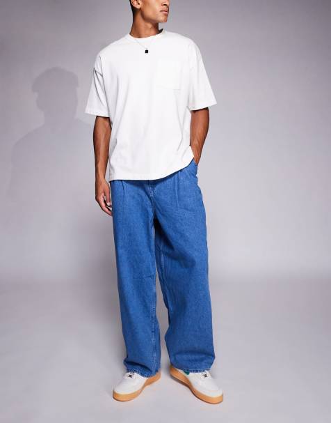 ASOS DESIGN – Weite Oversize-Jeans in mittelblauer Waschung und seitlichen Gürteln - view 1
