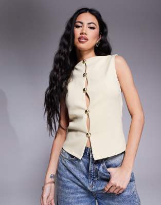 ASOS DESIGN - Weste aus Interlock-Jersey in Buttermilchgelb mit goldenen Metalldetails, Kombiteil
